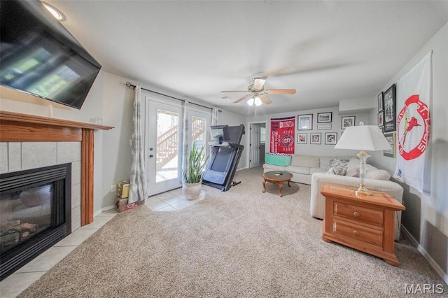 19580 Lyle Ln, Waynesville, MO 65583 - living room featuring a ceiling fan, a fireplace, tile patterned floors, and carpet flooring