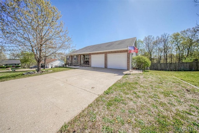 19580 Lyle Ln, Waynesville, MO 65583 - view of front facade with a garage, brick siding, and concrete driveway