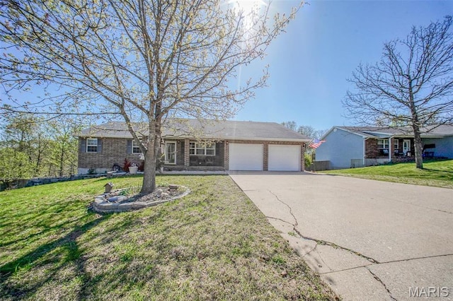 19580 Lyle Ln, Waynesville, MO 65583 - ranch-style house with an attached garage, brick siding, driveway, and a front lawn