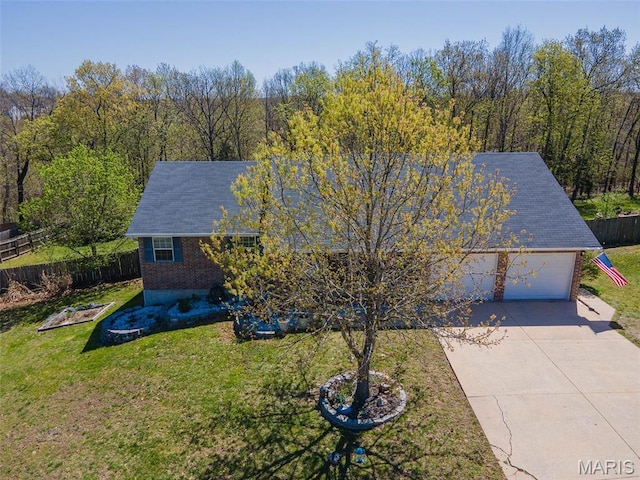 19580 Lyle Ln, Waynesville, MO 65583 - view of front of house with driveway, a garage, and brick siding
