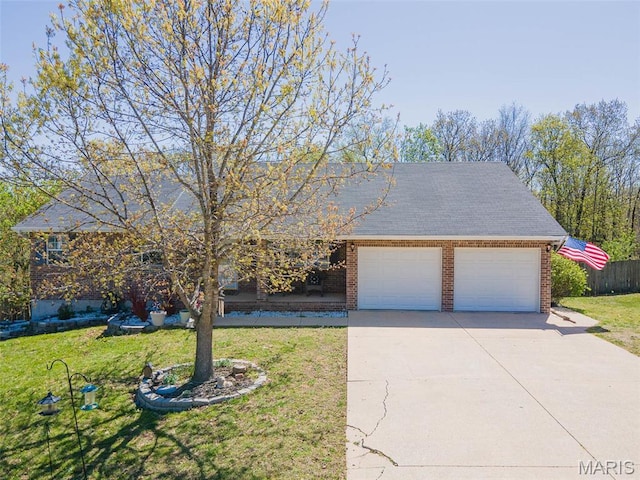 19580 Lyle Ln, Waynesville, MO 65583 - view of front of home featuring a garage, brick siding, and driveway