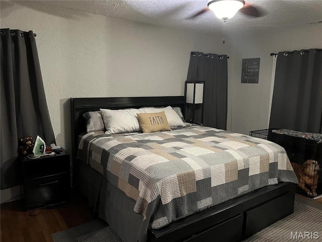 111 W Broadway St, Hayti, MO 63851 - bedroom with wood finished floors, a textured ceiling, and a ceiling fan