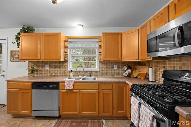 kitchen featuring stainless steel appliances, a sink, open shelves, decorative backsplash, and light countertops