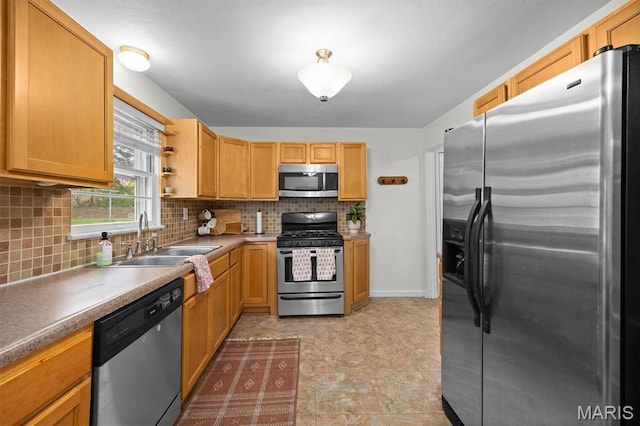 kitchen with stainless steel appliances, a sink, backsplash, and open shelves