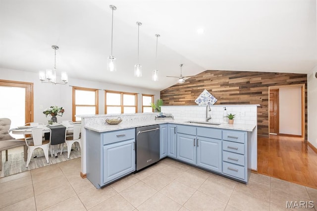 92 Rinderer Rd, Trenton, IL 62293 - kitchen featuring dishwasher, a sink, wooden walls, vaulted ceiling, and a chandelier