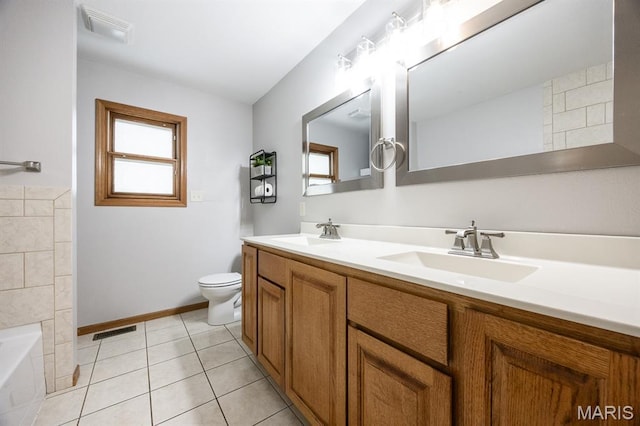 92 Rinderer Rd, Trenton, IL 62293 - full bathroom featuring plenty of natural light, double vanity, toilet, and a bath