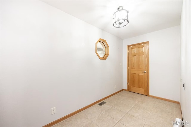 92 Rinderer Rd, Trenton, IL 62293 - spare room featuring baseboards, a chandelier, and light tile patterned floors