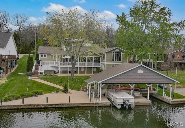 616 W Capri Dr, Bonne Terre, MO 63628 - dock with a water view, boat lift, a lawn, and a residential view