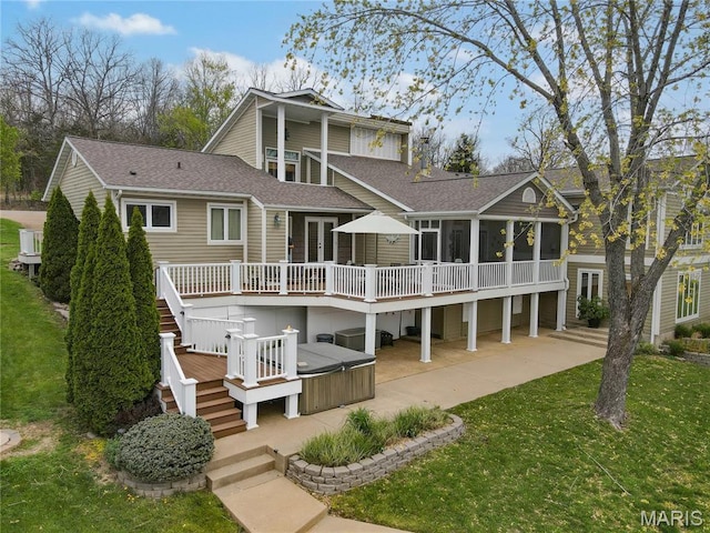 616 W Capri Dr, Bonne Terre, MO 63628 - back of property featuring a wooden deck, a sunroom, a hot tub, stairs, and roof with shingles