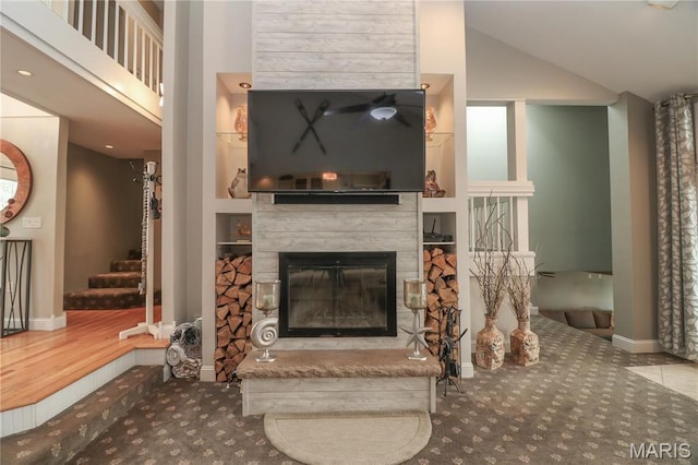 616 W Capri Dr, Bonne Terre, MO 63628 - carpeted living room featuring a fireplace, stairway, baseboards, and high vaulted ceiling