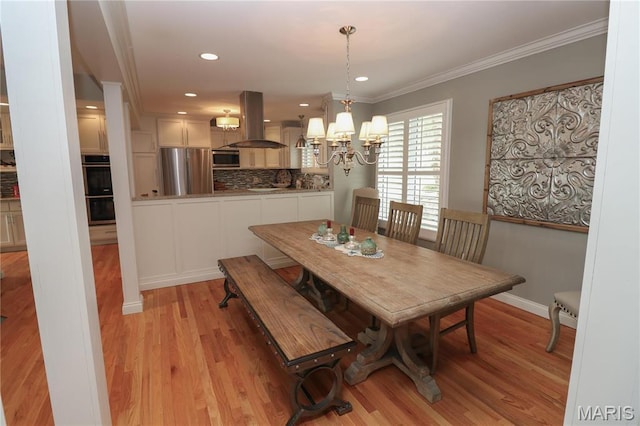 616 W Capri Dr, Bonne Terre, MO 63628 - dining area featuring a chandelier, light wood-style flooring, ornamental molding, baseboards, and recessed lighting