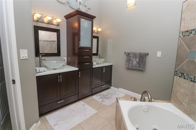 616 W Capri Dr, Bonne Terre, MO 63628 - full bathroom featuring a garden tub, double vanity, and tile patterned flooring