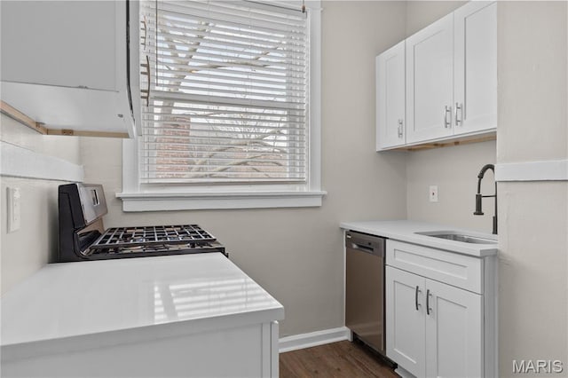 4913 Devonshire Ave, Saint Louis, MO 63109 - kitchen featuring dishwasher, a sink, light countertops, white cabinets, and range with gas cooktop