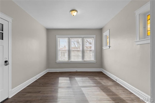 4913 Devonshire Ave, Saint Louis, MO 63109 - empty room featuring dark wood-type flooring and baseboards