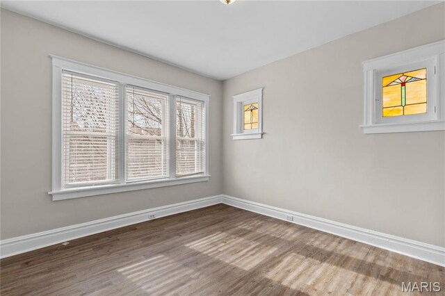 4913 Devonshire Ave, Saint Louis, MO 63109 - spare room featuring wood finished floors and baseboards