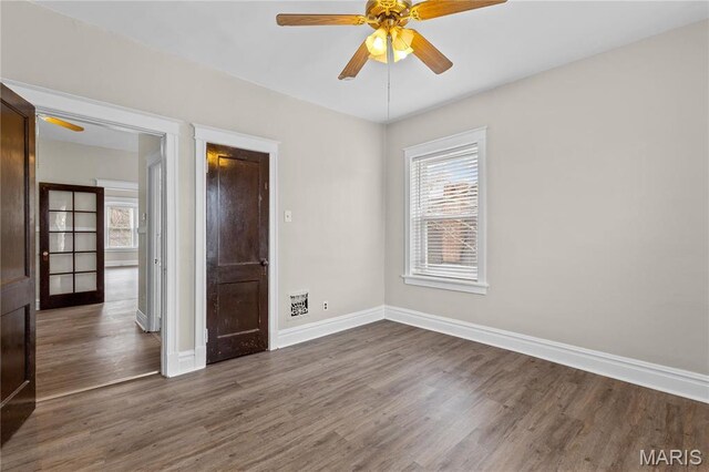 4913 Devonshire Ave, Saint Louis, MO 63109 - unfurnished bedroom with wood finished floors, baseboards, and ceiling fan