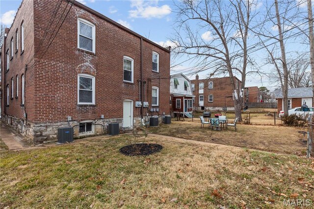 4913 Devonshire Ave, Saint Louis, MO 63109 - rear view of property with brick siding and central AC