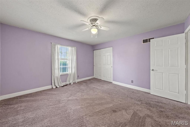 4044 Locke Ave, Bridgeton, MO 63044 - unfurnished bedroom with carpet flooring, baseboards, a closet, ceiling fan, and a textured ceiling