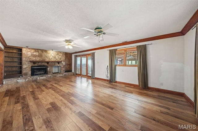 4044 Locke Ave, Bridgeton, MO 63044 - unfurnished living room featuring a textured ceiling, ceiling fan, hardwood / wood-style floors, ornamental molding, and baseboards