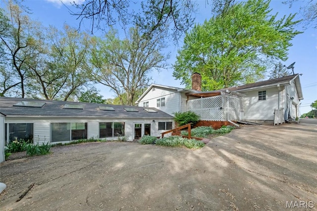 4044 Locke Ave, Bridgeton, MO 63044 - view of front of home with a chimney and driveway