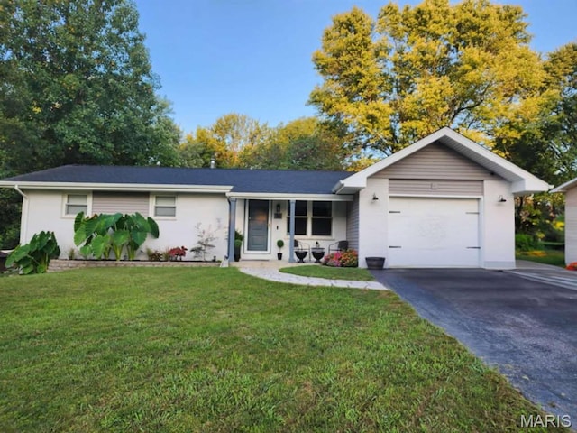 36 Pat Dr, Collinsville, IL 62234 - ranch-style home with an attached garage, driveway, and a front yard