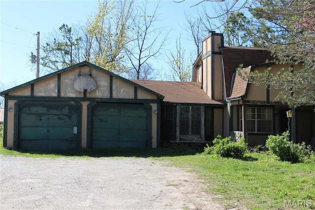 view of front of house featuring a chimney and roof with shingles