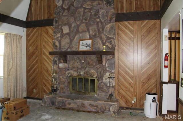 living area with a stone fireplace