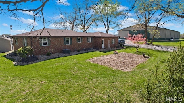 21510 Keyesport Rd, Keyesport, IL 62253 - rear view of house featuring a lawn, brick siding, and central AC unit