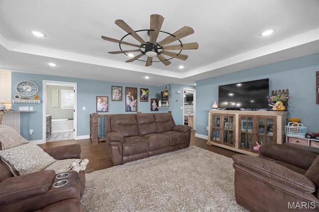 21510 Keyesport Rd, Keyesport, IL 62253 - living room with recessed lighting, ceiling fan, baseboards, a raised ceiling, and wood finished floors