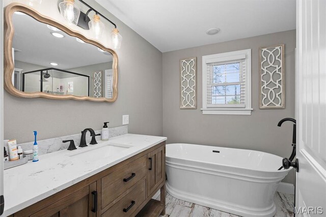 21510 Keyesport Rd, Keyesport, IL 62253 - full bath featuring vanity, a freestanding tub, and a shower with shower door