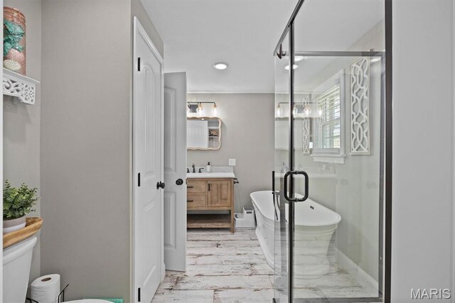 21510 Keyesport Rd, Keyesport, IL 62253 - bathroom featuring vanity, toilet, a shower stall, a soaking tub, and baseboards