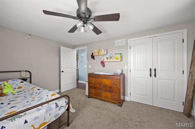 21510 Keyesport Rd, Keyesport, IL 62253 - bedroom with carpet, a closet, baseboards, and a ceiling fan