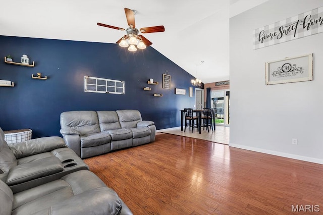 420 Glen Forest Dr, Troy, MO 63379 - living room with a ceiling fan, wood finished floors, baseboards, a chandelier, and high vaulted ceiling