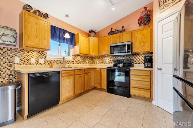 420 Glen Forest Dr, Troy, MO 63379 - kitchen featuring black appliances, a sink, lofted ceiling, light countertops, and backsplash