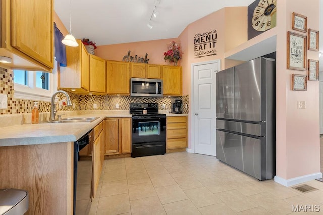 420 Glen Forest Dr, Troy, MO 63379 - kitchen with black appliances, a sink, rail lighting, light countertops, and decorative backsplash