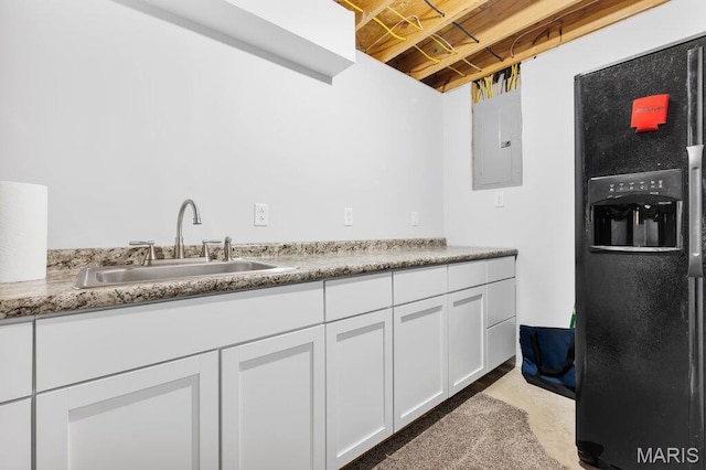 420 Glen Forest Dr, Troy, MO 63379 - kitchen featuring black refrigerator with ice dispenser, a sink, electric panel, white cabinets, and light countertops