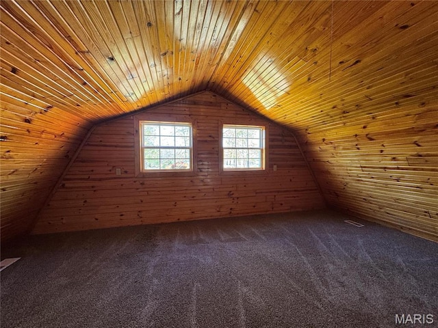 bonus room featuring wood ceiling, wood walls, lofted ceiling, and dark carpet