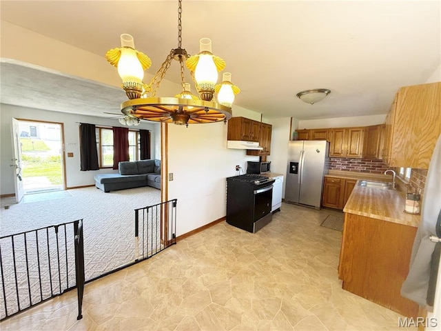 520 Keeton Rd, Rolla, MO 65401 - kitchen featuring stainless steel appliances, a sink, a chandelier, brown cabinets, and light countertops
