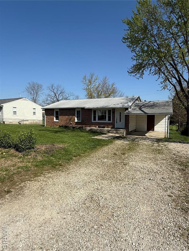 520 Keeton Rd, Rolla, MO 65401 - view of front of property with brick siding, a front yard, and driveway