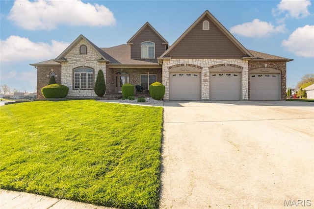 2017 Richview Dr, Saint Jacob, IL 62281 - french provincial home featuring a garage, stone siding, a front lawn, and concrete driveway