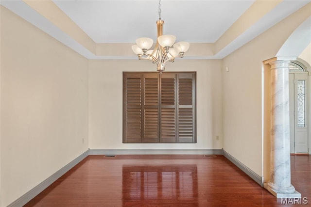 2017 Richview Dr, Saint Jacob, IL 62281 - unfurnished dining area with ornate columns, a chandelier, baseboards, and wood finished floors