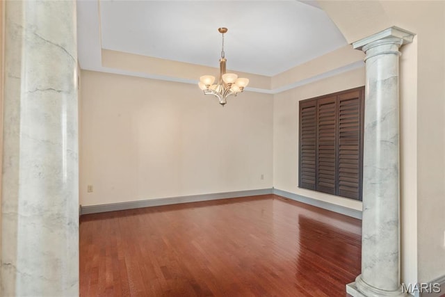 2017 Richview Dr, Saint Jacob, IL 62281 - empty room with decorative columns, wood finished floors, a chandelier, and baseboards
