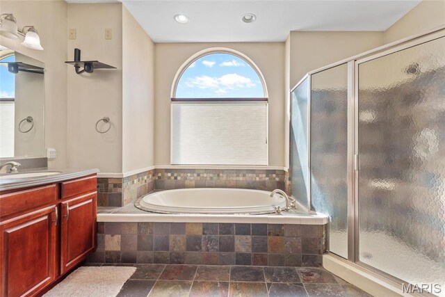 2017 Richview Dr, Saint Jacob, IL 62281 - full bathroom featuring a shower stall, a garden tub, vanity, stone finish floors, and recessed lighting