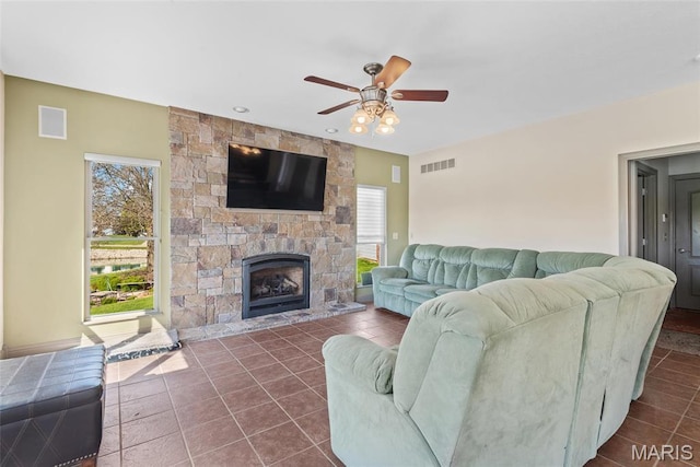2017 Richview Dr, Saint Jacob, IL 62281 - living area with ceiling fan, dark tile patterned flooring, a stone fireplace, and recessed lighting