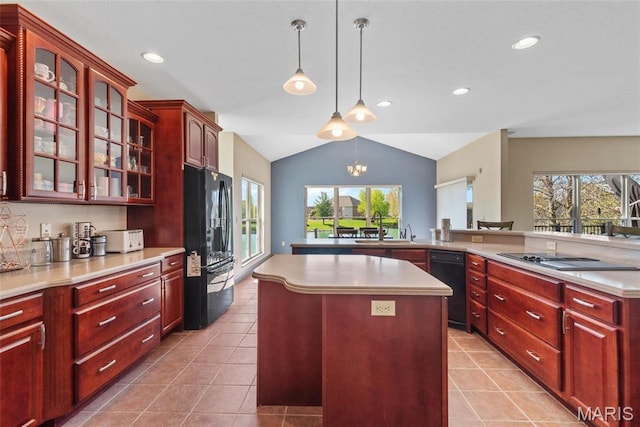 2017 Richview Dr, Saint Jacob, IL 62281 - kitchen with black appliances, reddish brown cabinets, a center island, a sink, and vaulted ceiling