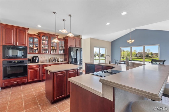 2017 Richview Dr, Saint Jacob, IL 62281 - kitchen featuring black appliances, a spacious island, a sink, light countertops, and lofted ceiling