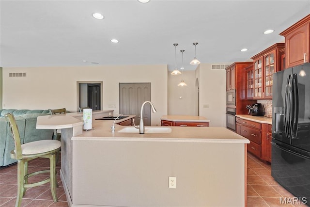 2017 Richview Dr, Saint Jacob, IL 62281 - kitchen featuring black appliances, a center island with sink, tile patterned floors, a sink, and recessed lighting