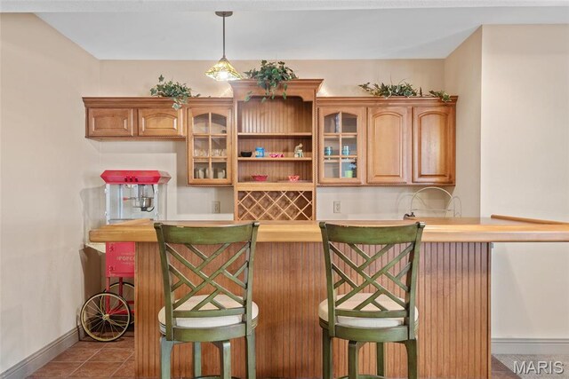 2017 Richview Dr, Saint Jacob, IL 62281 - indoor wet bar featuring baseboards, tile patterned flooring, and hanging light fixtures