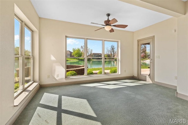 2017 Richview Dr, Saint Jacob, IL 62281 - carpeted empty room with a water view, plenty of natural light, baseboards, and a ceiling fan