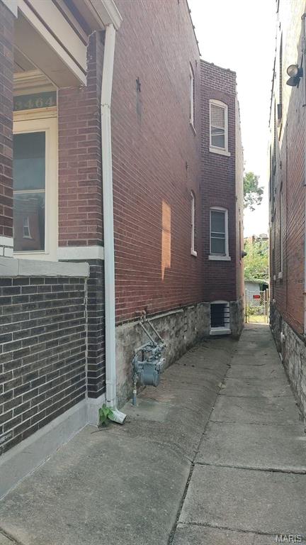 3464 Montana St, Saint Louis, MO 63118 - view of side of home with brick siding